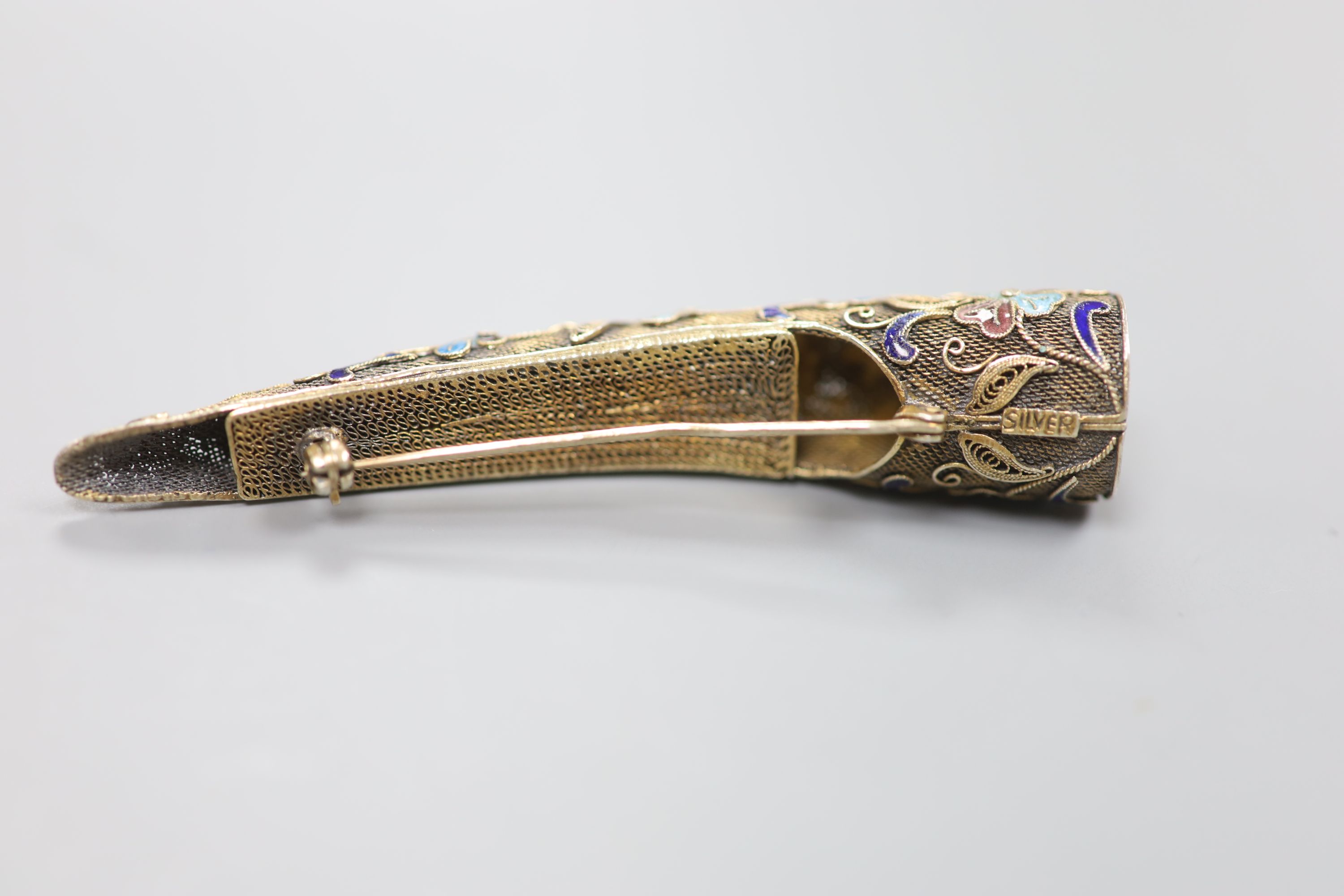 A late 19th/early 20th century Chinese filigree white metal, enamel and gem set nail guard brooch, 85mm.